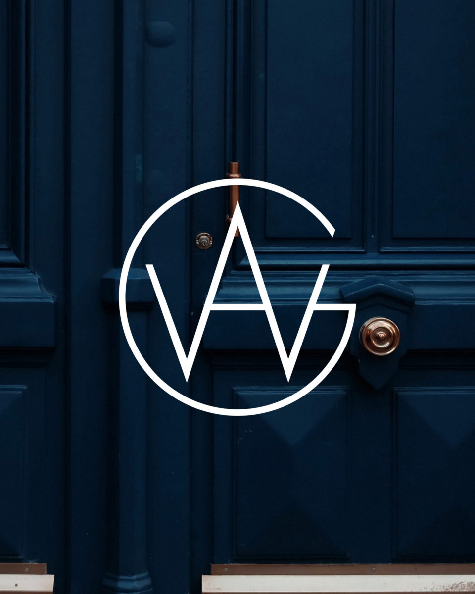 AWG Logo on deep blue wooden door with copper accents
