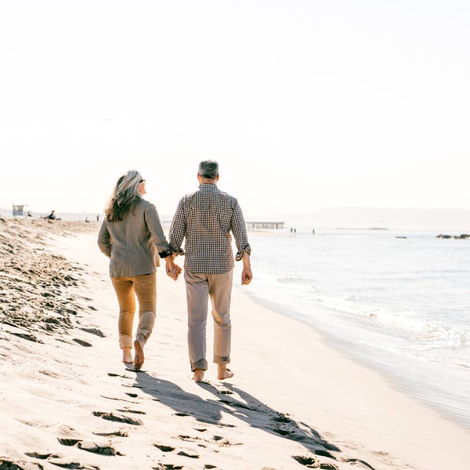Couple walking on beach side